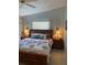 Inviting bedroom with a king bed, carpet, and a soothing color palette at 3300 Loveland Blvd # 1201, Punta Gorda, FL 33980