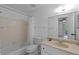 A cozy bathroom with a shower-tub combo and a single sink vanity at 3351 Ramblewood Ct # 3351, Sarasota, FL 34237