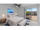 Modern bedroom with a sliding door and a view of the outdoor balcony at 3351 Ramblewood Ct # 3351, Sarasota, FL 34237