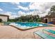 Large community pool with lounge chairs, perfect for relaxing and enjoying the sunshine at 3351 Ramblewood Ct # 3351, Sarasota, FL 34237