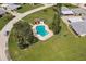 Aerial view of a community pool surrounded by lush greenery, offering a serene retreat at 3351 Ramblewood Ct # 3351, Sarasota, FL 34237