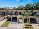 View of a well-maintained townhome with a brown roof, balconies and covered parking at 3351 Ramblewood Ct # 3351, Sarasota, FL 34237