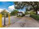 Community entrance with gate and manicured landscaping, providing a secure and welcoming entry at 3351 Ramblewood Ct # 3351, Sarasota, FL 34237