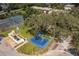 Aerial view of the community playground and tennis courts, offering recreational activities for all at 3351 Ramblewood Ct # 3351, Sarasota, FL 34237