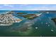 Aerial view of beautiful waterfront community with bridge access, showcasing the bay and surrounding landscapes at 4074 N Beach Rd # Ctg5, Englewood, FL 34223