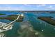 Aerial view of waterfront property showcasing boat access to the Gulf of Mexico through the bay at 4074 N Beach Rd # Ctg5, Englewood, FL 34223