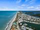 Beautiful aerial view of the waterfront community, showcasing the pristine beach, bay, and surrounding landscapes at 4074 N Beach Rd, Englewood, FL 34223