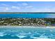 Gorgeous aerial view of the waterfront community, highlighting a stunning bay view, surrounding landscapes and beachfront access at 4074 N Beach Rd # Ctg5, Englewood, FL 34223