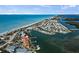 Aerial view of waterfront property showcasing docks and boat access to the Gulf of Mexico at 4074 N Beach Rd, Englewood, FL 34223