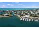 Picturesque aerial view of a waterfront community, featuring a marina, lush landscaping, and various leisure facilities at 4074 N Beach Rd, Englewood, FL 34223