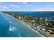 Aerial view of the beach community, showcasing the pristine shoreline and Gulf access at 4074 N Beach Rd, Englewood, FL 34223