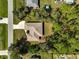 Aerial shot of a house with brown roof surrounded by trees, highlighting privacy and the location at 4344 Ozark Ave, North Port, FL 34287