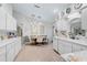 Bright kitchen showcasing white cabinets, modern lighting, and an adjacent dining area at 4344 Ozark Ave, North Port, FL 34287