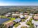 Overhead view of the home, showcasing a mature treed lot, and a neighborhood at 446 Pendleton Ct, Venice, FL 34292