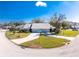 Aerial view of the property showcasing the home's position on a corner lot with meticulous landscaping at 446 Pendleton Ct, Venice, FL 34292