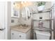 The bathroom features a granite-look counter, providing a blend of style and functionality at 446 Pendleton Ct, Venice, FL 34292