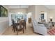 Dining area flows into the living room with lovely natural lighting at 446 Pendleton Ct, Venice, FL 34292