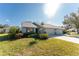 Charming single-story home featuring a well-manicured lawn and attached two-car garage at 446 Pendleton Ct, Venice, FL 34292