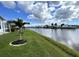 Tranquil backyard view of the waterway from the property's edge at 473 Sharks Pt, North Port, FL 34287