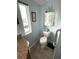 Well-lit bathroom with a toilet and sink at 473 Sharks Pt, North Port, FL 34287