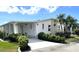 Charming single-story home with carport and meticulously maintained landscaping at 473 Sharks Pt, North Port, FL 34287