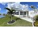 Inviting screened-in porch perfect for enjoying the outdoor view of the pond at 473 Sharks Pt, North Port, FL 34287