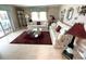 Inviting living room showcasing two sofas and a large patterned area rug at 473 Sharks Pt, North Port, FL 34287