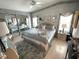 Cozy main bedroom with a ceiling fan, ample natural light, and matching bedside tables at 473 Sharks Pt, North Port, FL 34287