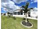 Scenic backyard with well-maintained lawn and ample room for outdoor seating at 473 Sharks Pt, North Port, FL 34287