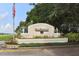 Welcoming Southwood community sign, surrounded by lush landscaping and an American flag waving in the breeze at 5071 Winter Rose Way, Venice, FL 34293