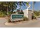 Elegant Whitestone community sign featuring manicured landscaping and a majestic eagle statue on a sunny day at 5071 Winter Rose Way, Venice, FL 34293