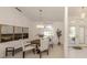 Dining room with an elegant chandelier and a view of the front yard at 5071 Winter Rose Way, Venice, FL 34293