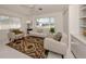 Bright living room features neutral colors, a ceiling fan, and built in shelving at 5071 Winter Rose Way, Venice, FL 34293