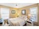 Comfortable bedroom with natural light from shuttered windows and serene decor at 537 Foxwood Blvd, Englewood, FL 34223