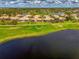 Aerial view of the home backing up to golf course and pond offering a serene setting at 5371 White Ibis Dr, North Port, FL 34287