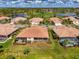 Aerial view of the neighborhood featuring tile roofs, screened lanais, and lush landscaping at 5371 White Ibis Dr, North Port, FL 34287