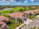 Panoramic aerial view of home located on a golf course and lake community at 5371 White Ibis Dr, North Port, FL 34287