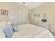 Cozy bedroom featuring a double closet and wicker furnishings at 5371 White Ibis Dr, North Port, FL 34287