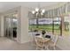 Breakfast nook with golf course view and sliding doors to patio at 5371 White Ibis Dr, North Port, FL 34287