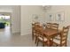 Dining area featuring a wood table with seating and a view of the outdoor scenery at 5371 White Ibis Dr, North Port, FL 34287