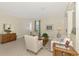 Cozy living room with patterned chairs, tiled floors, and traditional-style decor at 5371 White Ibis Dr, North Port, FL 34287