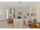 Bright living room featuring neutral walls, tiled flooring, and decorative archways at 5371 White Ibis Dr, North Port, FL 34287