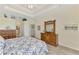 Light and bright main bedroom with wood floors and ensuite bathroom at 5371 White Ibis Dr, North Port, FL 34287