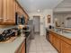 Bright kitchen featuring stainless steel appliances, and tile floors at 564 Meadow Sweet Cir, Osprey, FL 34229