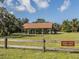 Scenic picnic area with a covered pavilion and wooden fence, perfect for outdoor gatherings at 564 Meadow Sweet Cir, Osprey, FL 34229