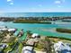 Gorgeous aerial view of coastal homes on the water with stunning turquoise inlets and blue ocean views at 641 Bayshore Rd, Nokomis, FL 34275