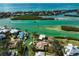 Aerial view showcasing a canal-front neighborhood with private docks and easy access to the tranquil waters of the bay at 641 Bayshore Rd, Nokomis, FL 34275