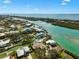 Aerial view of the waterfront properties and the community at 641 Bayshore Rd, Nokomis, FL 34275