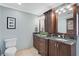 Bathroom boasts dual vanities with granite countertops, and warm lighting creating a spa-like ambiance at 641 Bayshore Rd, Nokomis, FL 34275