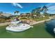 Gorgeous waterfront home with a private dock, beautiful landscaping, and boat, offering serene waterfront living at 641 Bayshore Rd, Nokomis, FL 34275